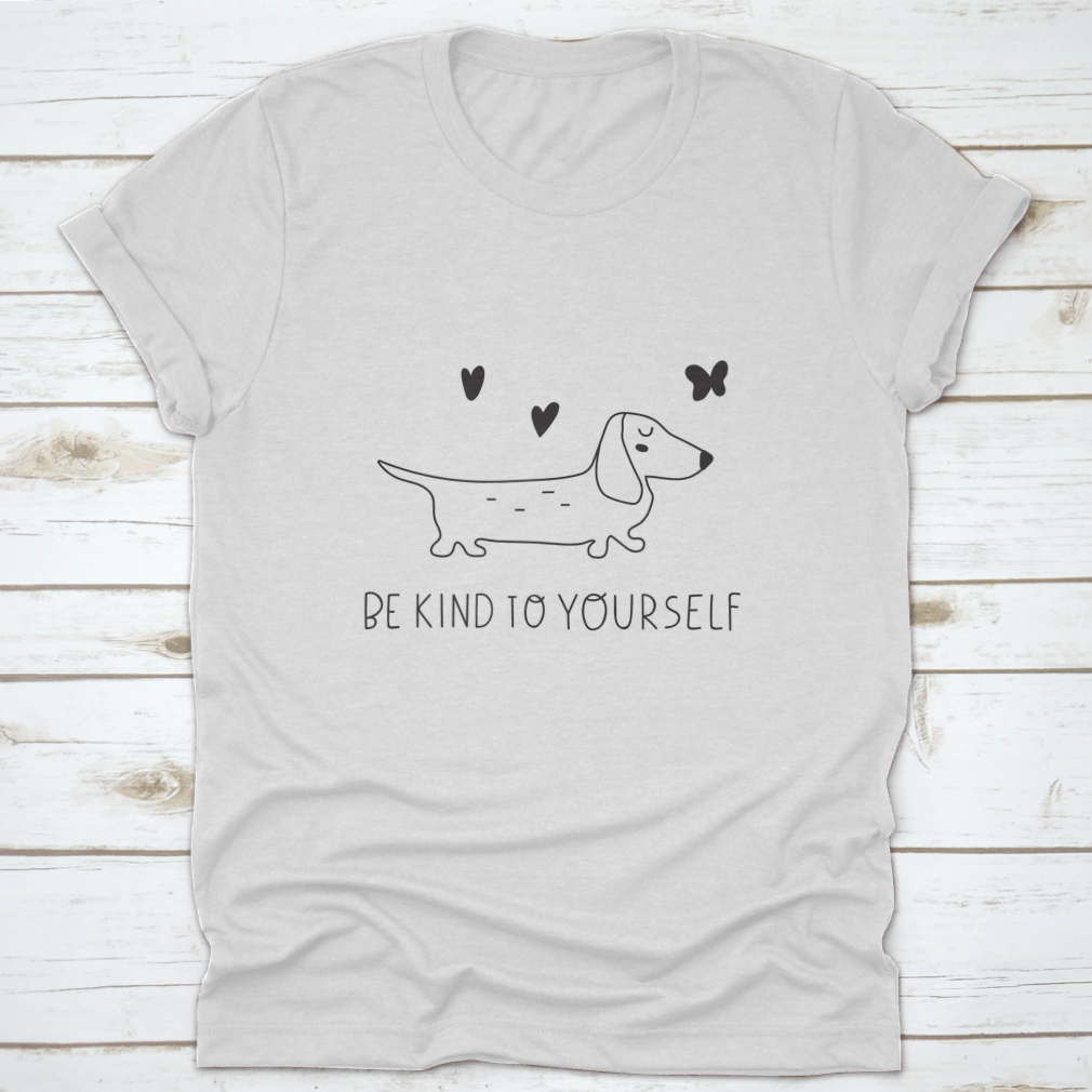 A soft cotton t-shirt featuring an inspirational design that reads 'Be Kind To Yourself', perfect for casual wear.