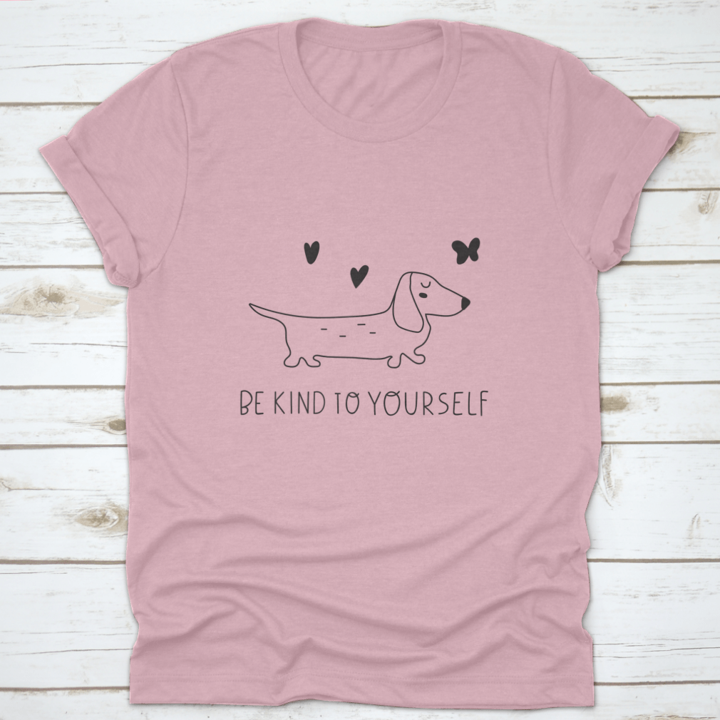 A soft cotton t-shirt featuring an inspirational design that reads 'Be Kind To Yourself', perfect for casual wear.