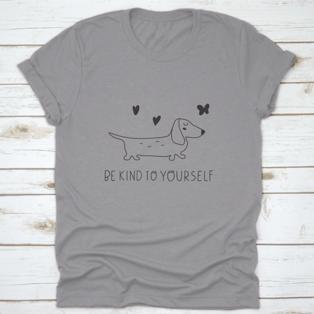 A soft cotton t-shirt featuring an inspirational design that reads 'Be Kind To Yourself', perfect for casual wear.