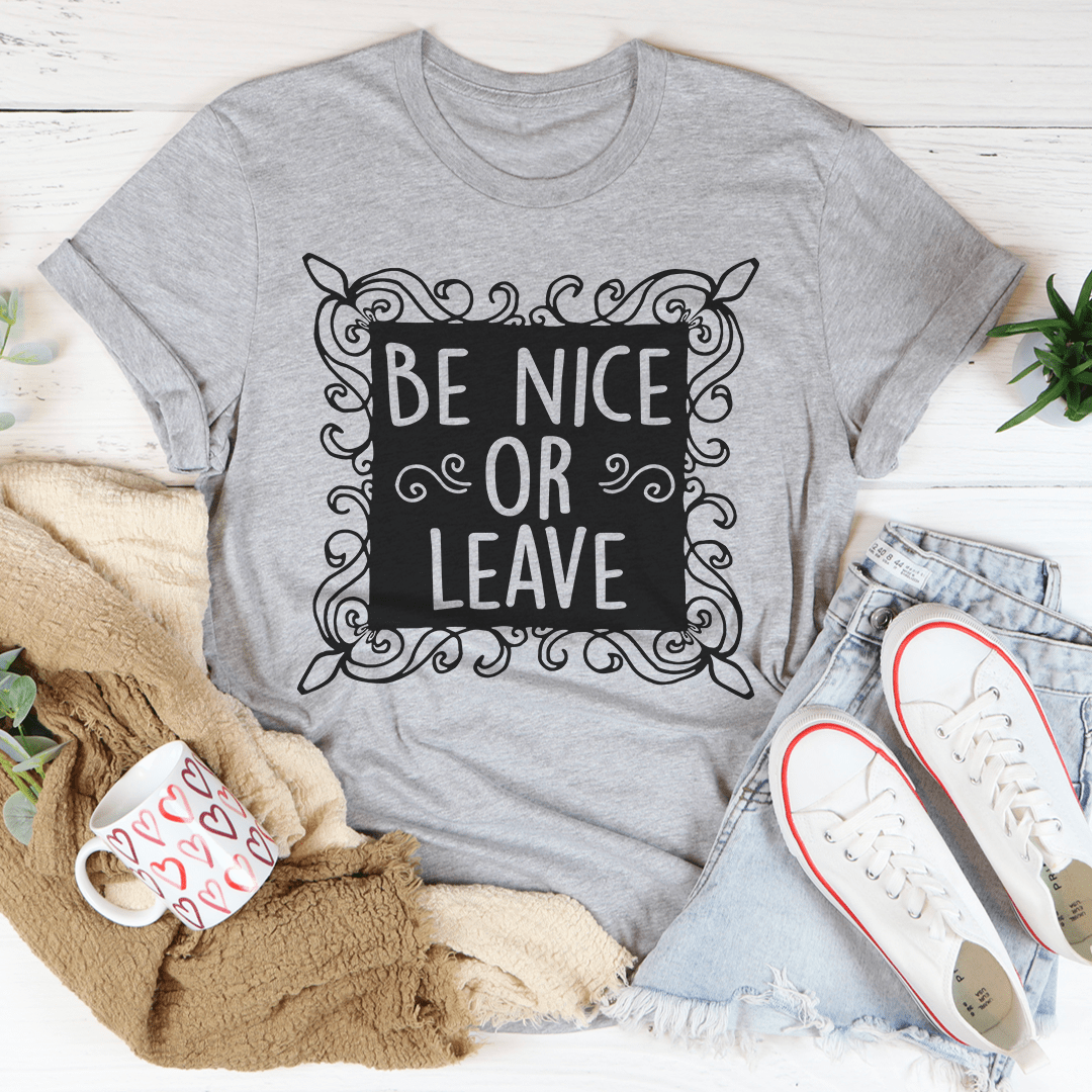 Be Nice Or Leave T-Shirt made from soft ring-spun cotton, featuring double stitching for durability and a bold printed message.