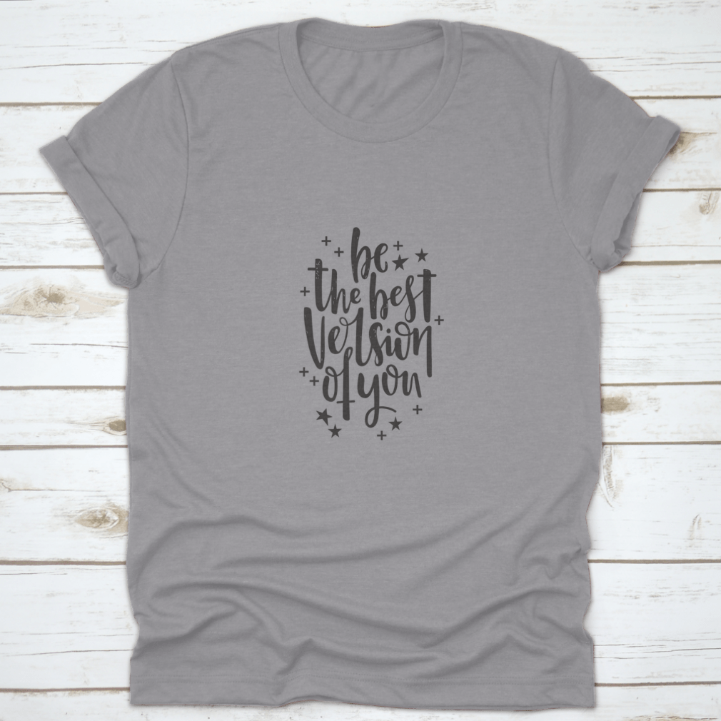 A stylish t-shirt featuring hand-drawn lettering that reads 'Be The Best Version Of You', made from soft cotton fabric.