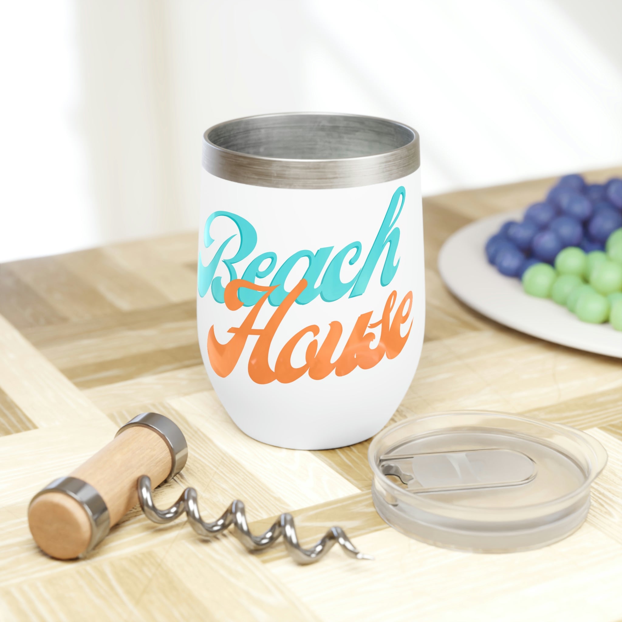 A stylish Beach House Chill Wine Tumbler made of stainless steel, featuring a double-insulated design for temperature retention, perfect for outdoor use.