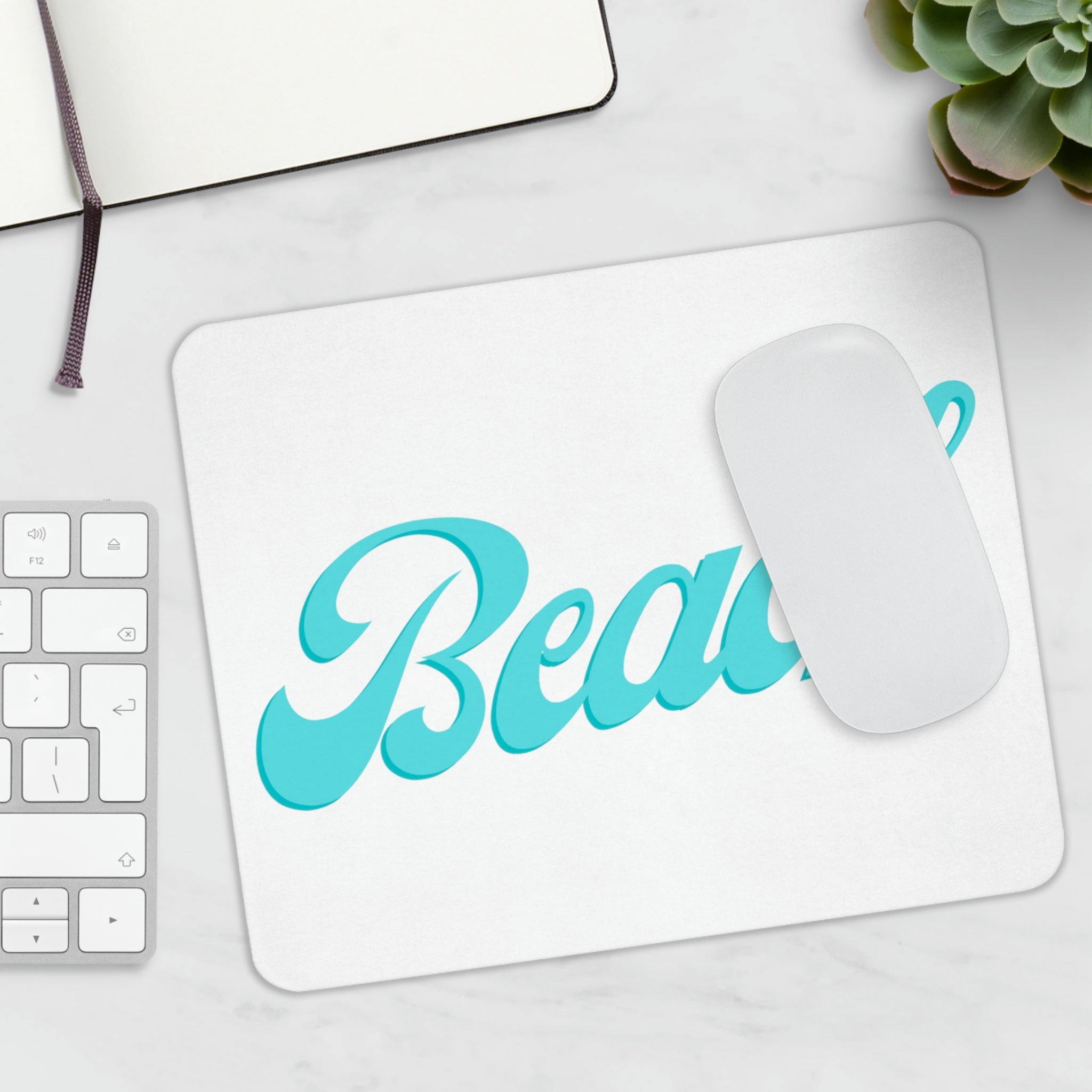 A vibrant beach-themed mouse pad featuring a scenic ocean view, perfect for enhancing any workspace.