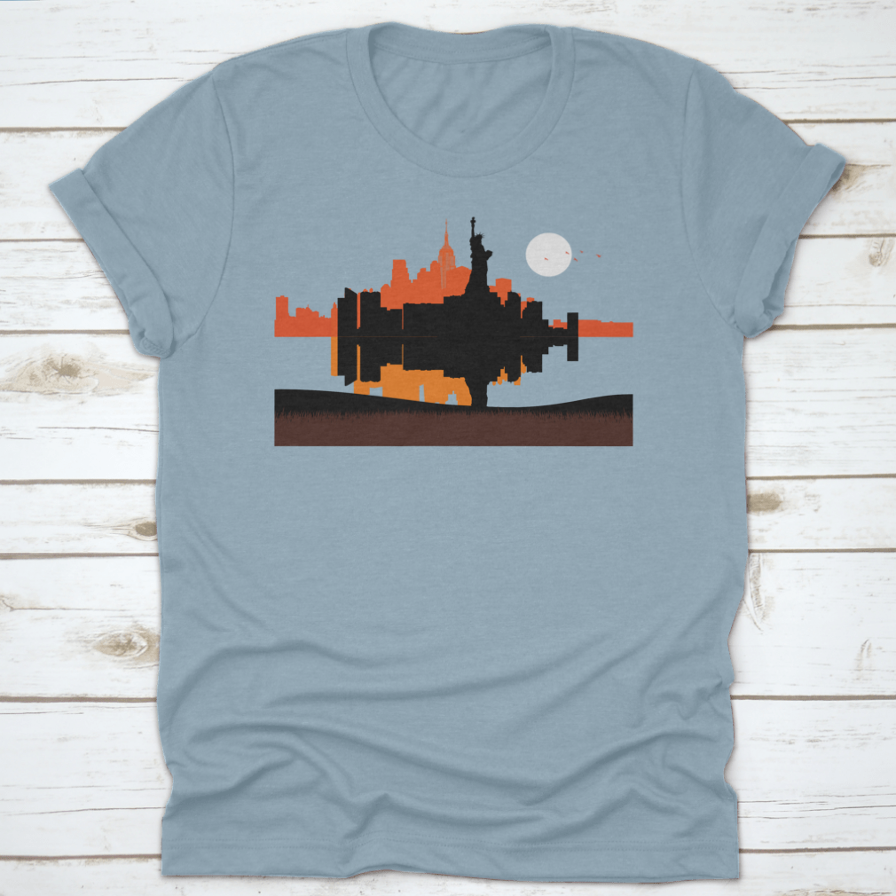 A stylish t-shirt featuring a beautiful sunset design of the Statue of Liberty with New York City skyline in the background.