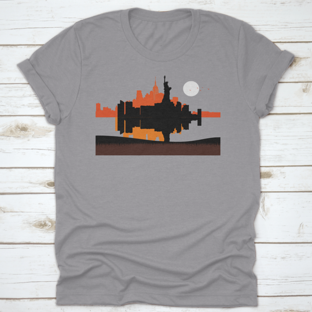 A stylish t-shirt featuring a beautiful sunset design of the Statue of Liberty with New York City skyline in the background.