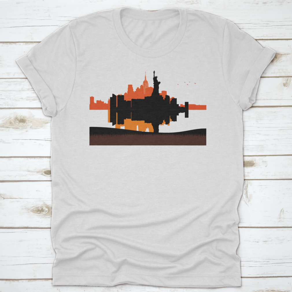 A stylish t-shirt featuring a beautiful sunset design of the Statue of Liberty with New York City skyline in the background.