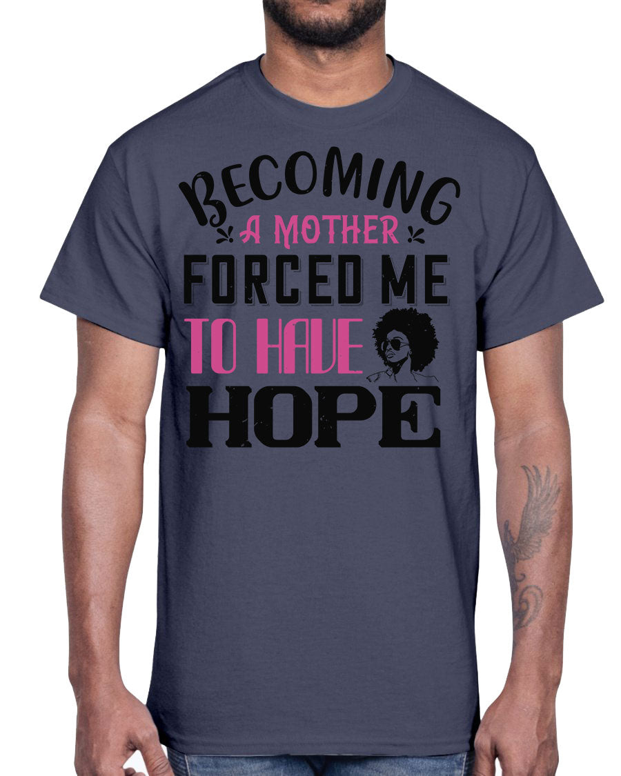 A stylish Afro Cotton Tee featuring the phrase 'Becoming a Mother Forced Me to Have Hope', showcasing its classic fit and soft fabric.