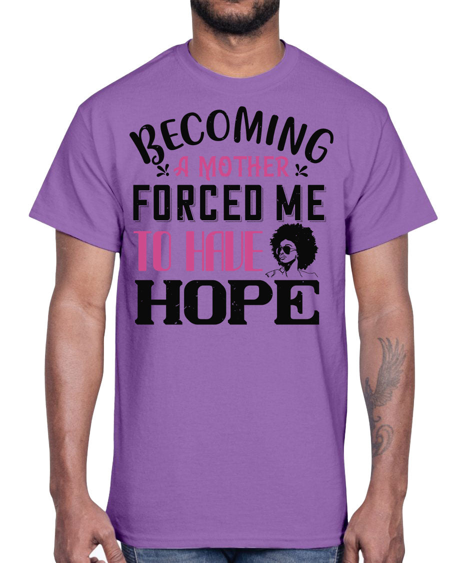 A stylish Afro Cotton Tee featuring the phrase 'Becoming a Mother Forced Me to Have Hope', showcasing its classic fit and soft fabric.