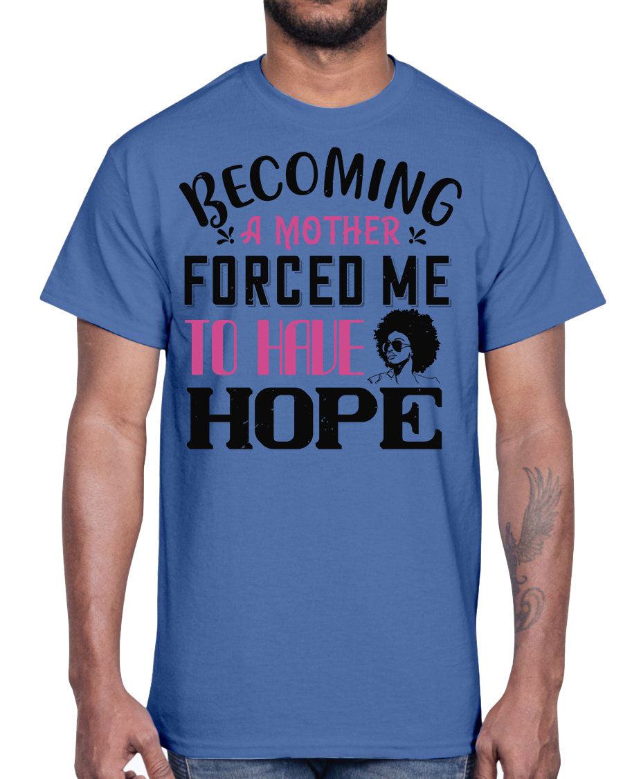 A stylish Afro Cotton Tee featuring the phrase 'Becoming a Mother Forced Me to Have Hope', showcasing its classic fit and soft fabric.