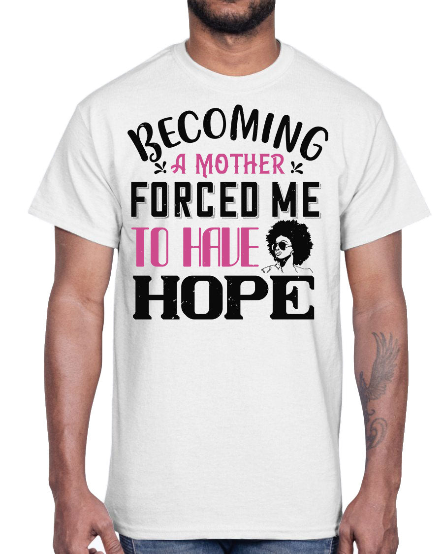 A stylish Afro Cotton Tee featuring the phrase 'Becoming a Mother Forced Me to Have Hope', showcasing its classic fit and soft fabric.