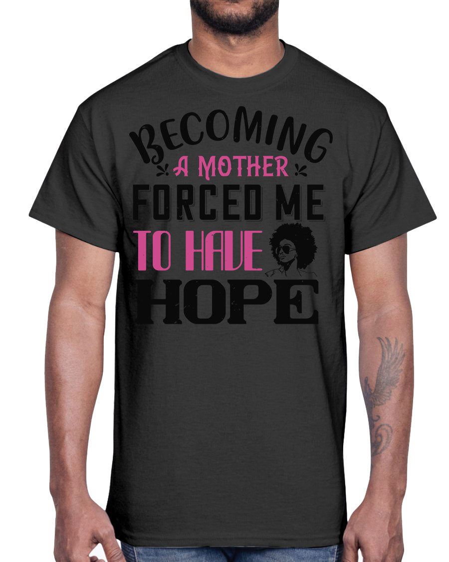 A stylish Afro Cotton Tee featuring the phrase 'Becoming a Mother Forced Me to Have Hope', showcasing its classic fit and soft fabric.