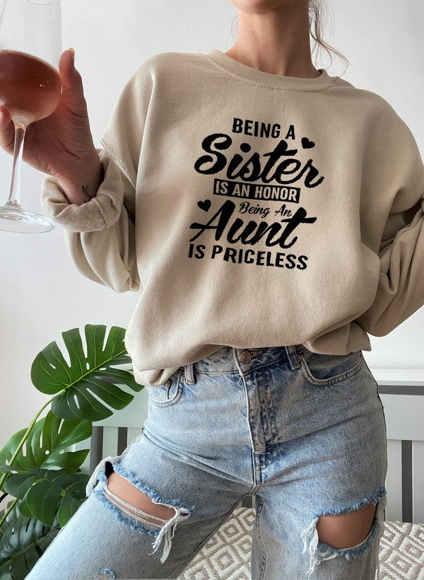 Cozy sweatshirt with the phrase 'Being A Sister Is An Honor Being An Aunt Is Priceless' designed for warmth and comfort.