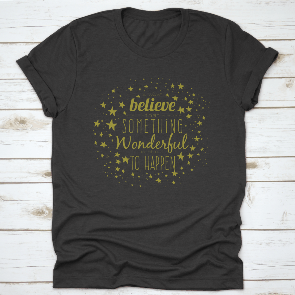 A stylish 'Believe Something Wonderful To Happen' T-shirt made from 100% cotton, featuring a classic fit and motivational design.