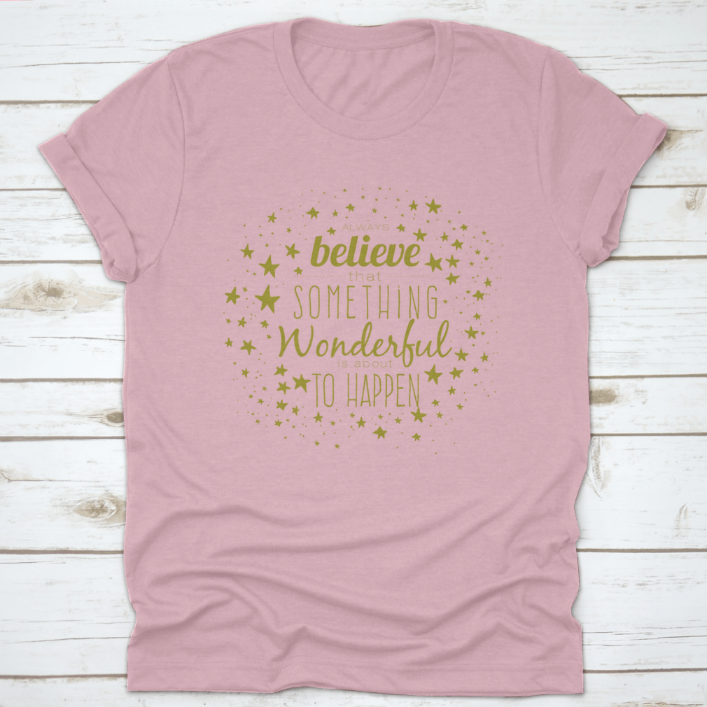 A stylish 'Believe Something Wonderful To Happen' T-shirt made from 100% cotton, featuring a classic fit and motivational design.