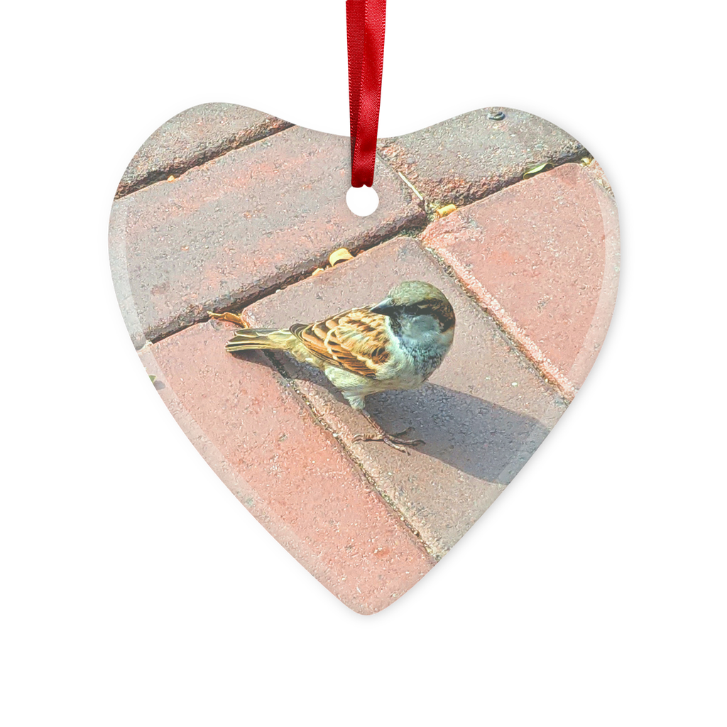 A beautiful Bird Glass Hanging Ornament in round and heart shapes, featuring a red ribbon and gold string for hanging.