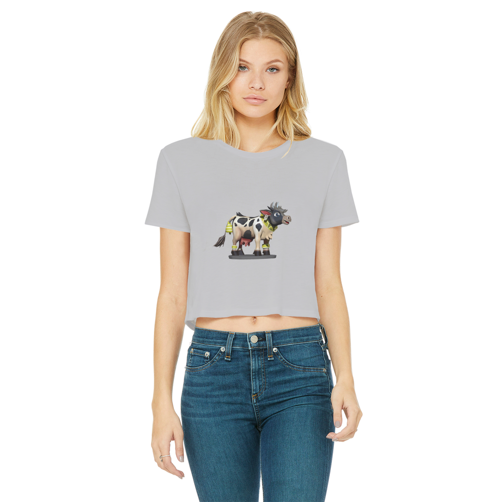 Black and white cropped t-shirt featuring a cow print design, short sleeves, and a raw edge hem, perfect for casual wear.