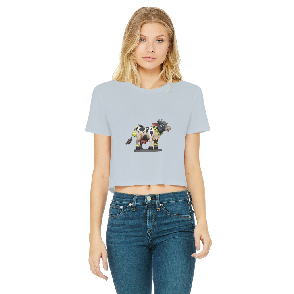 Black and white cropped t-shirt featuring a cow print design, short sleeves, and a raw edge hem, perfect for casual wear.