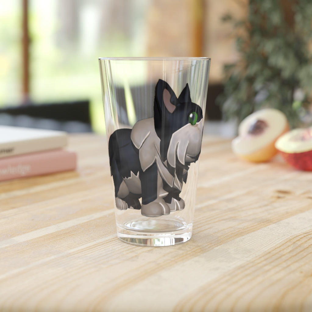 A clear 16oz Black Dog pint glass with custom printed design, showcasing its elegant shape and durable construction.