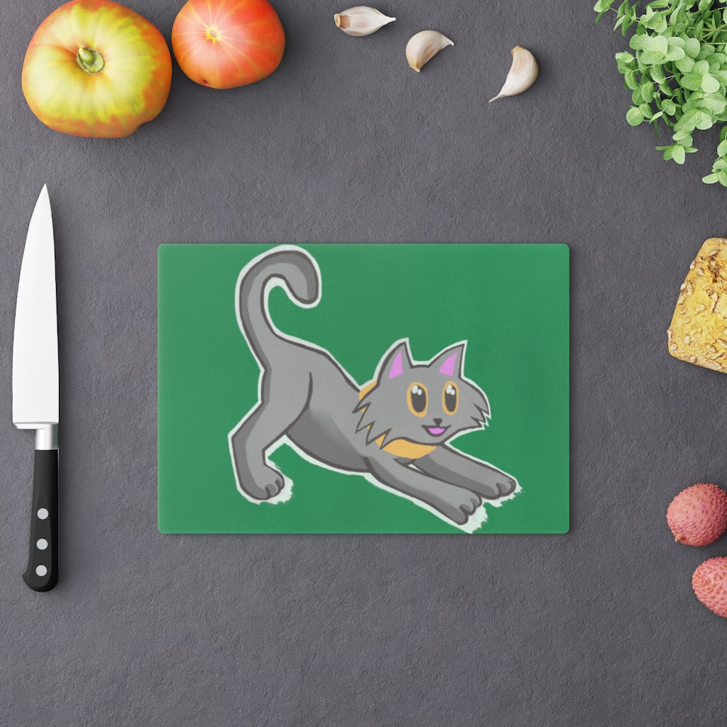 A stylish Black Kitty Cutting Board made of tempered glass, featuring a playful black cat design and four rubber dots for stability.