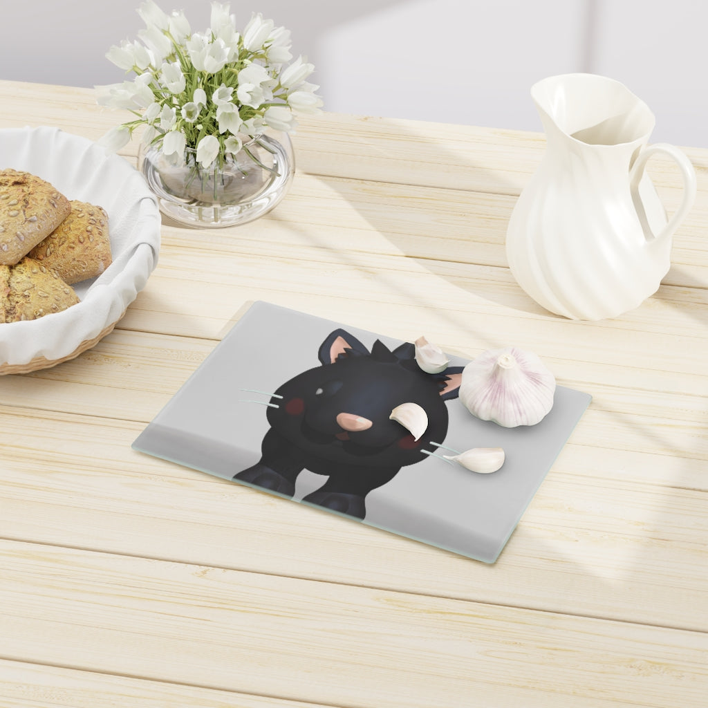 A stylish Black Kitty Cutting Board made of tempered glass, featuring a cute black cat design and four rubber dots for stability.