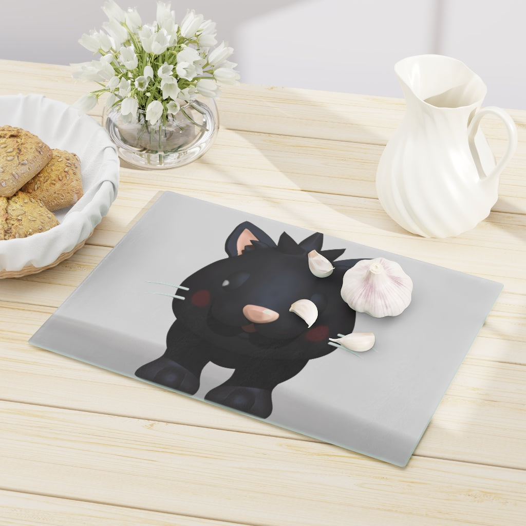 A stylish Black Kitty Cutting Board made of tempered glass, featuring a cute black cat design and four rubber dots for stability.