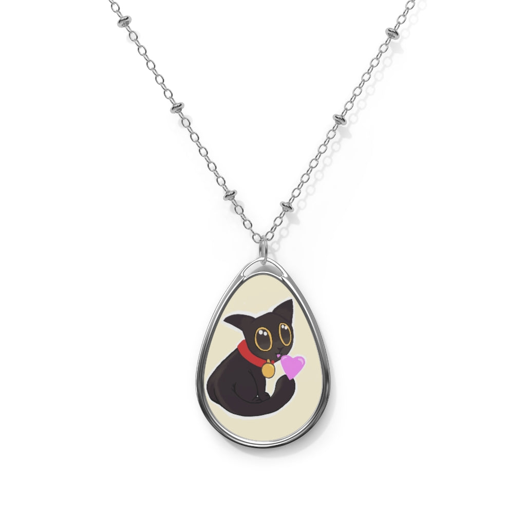 Black Kitty Oval Necklace featuring a unique ellipse-shaped brass pendant with a white print base and a lobster clasp closure.