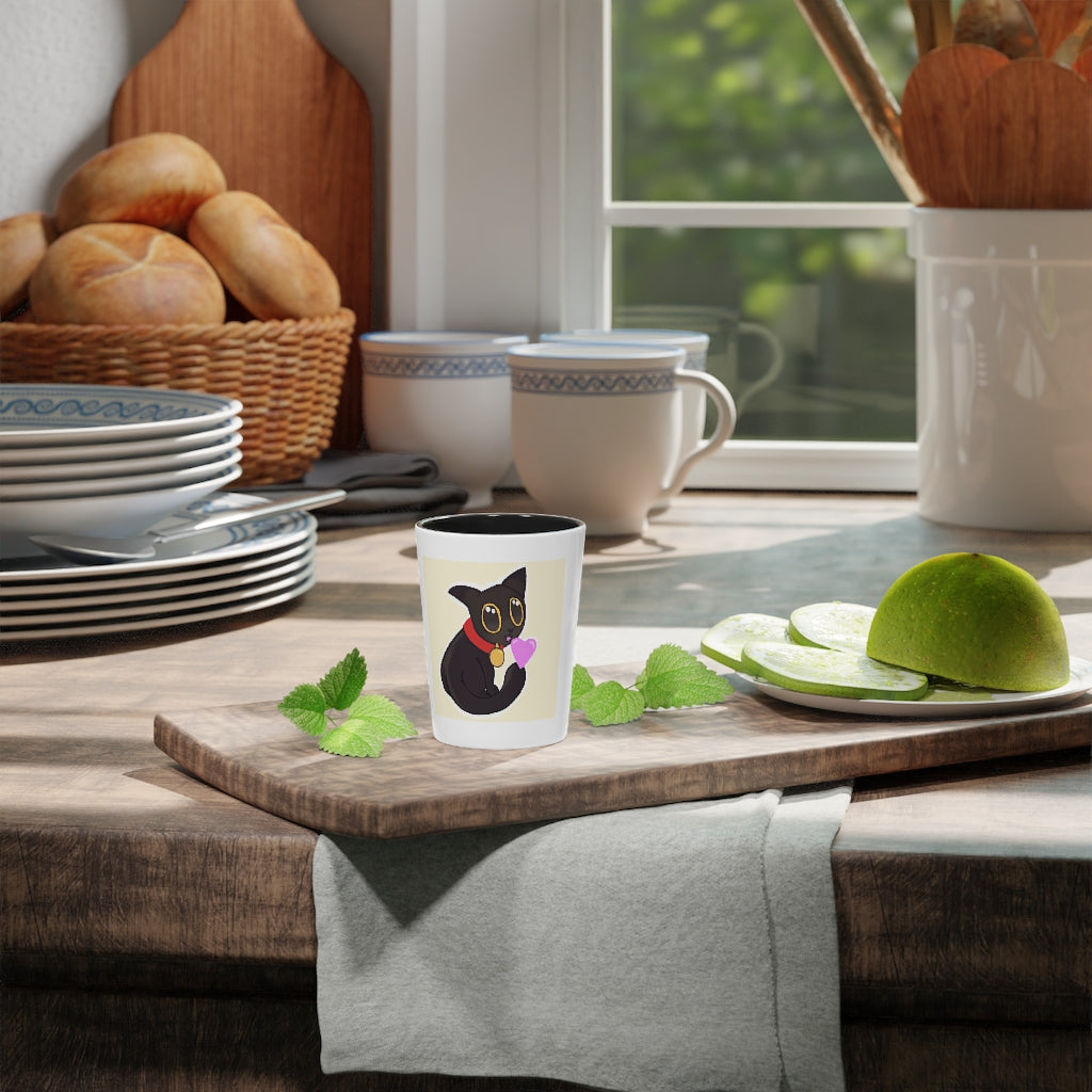 A stylish Black Kitty Shot Glass with a sleek ceramic design, featuring a black interior and a customizable exterior, perfect for gatherings and gifting.