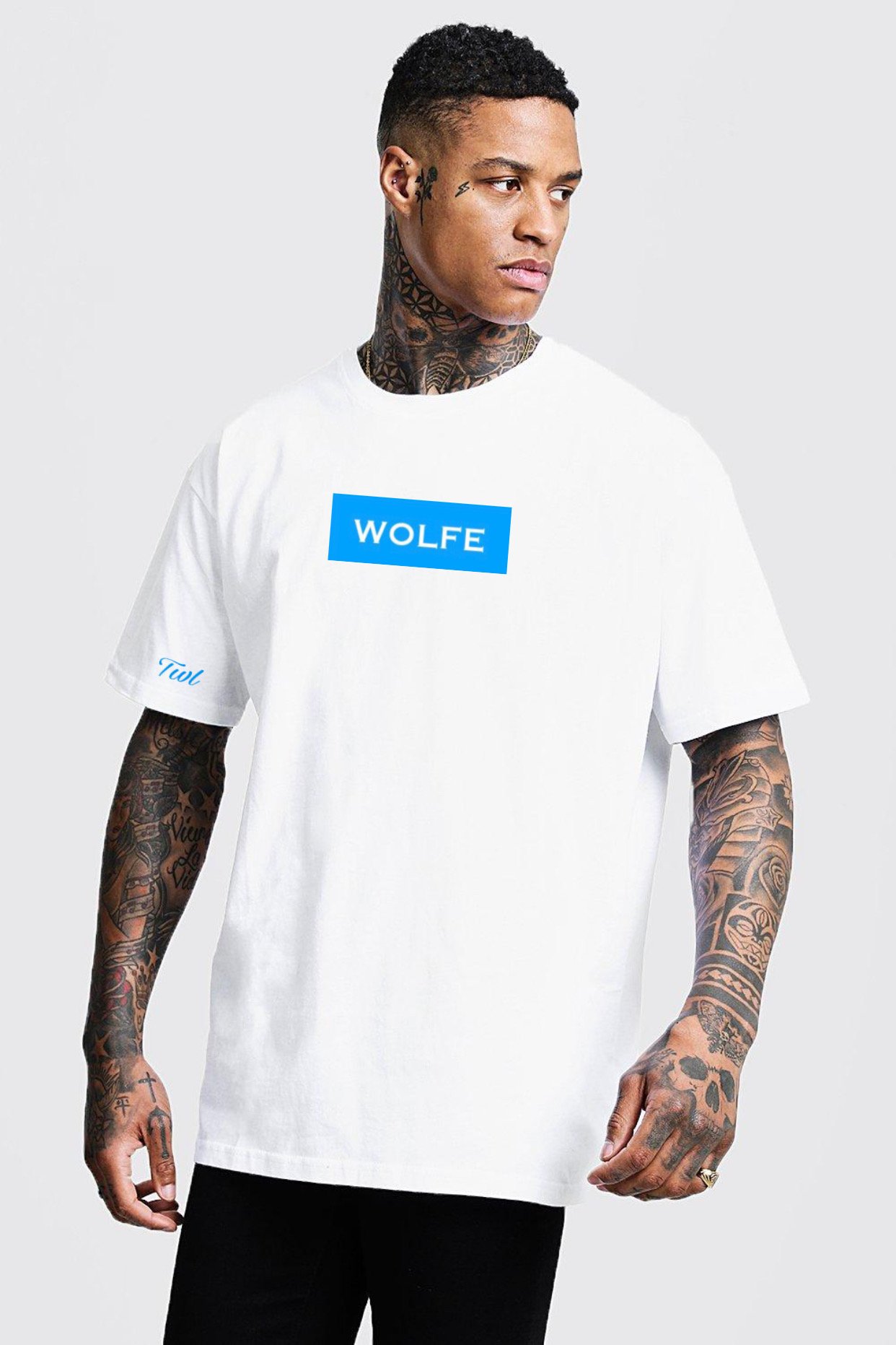 A stylish Blue Box Logo Tee featuring a blue box with 'WOLFE' printed in white on the front and 'TWL' embroidered on the right sleeve.