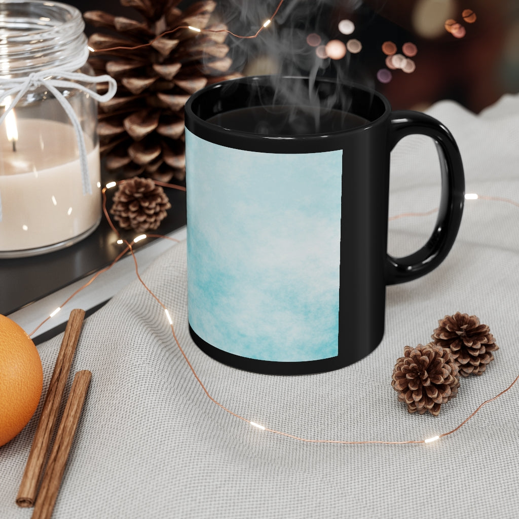 A stylish 11oz black ceramic mug featuring blue cloud designs, perfect for coffee, tea, or hot chocolate.