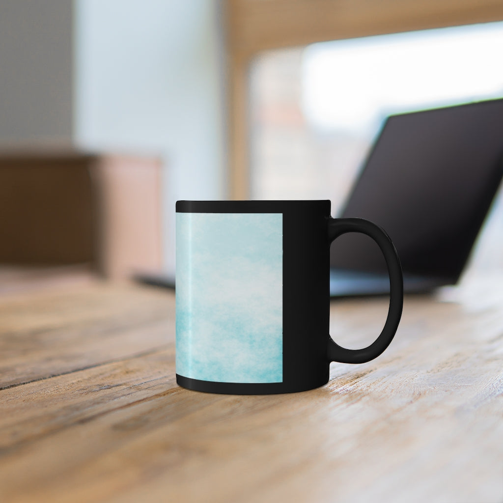 A stylish 11oz black ceramic mug featuring blue cloud designs, perfect for coffee, tea, or hot chocolate.