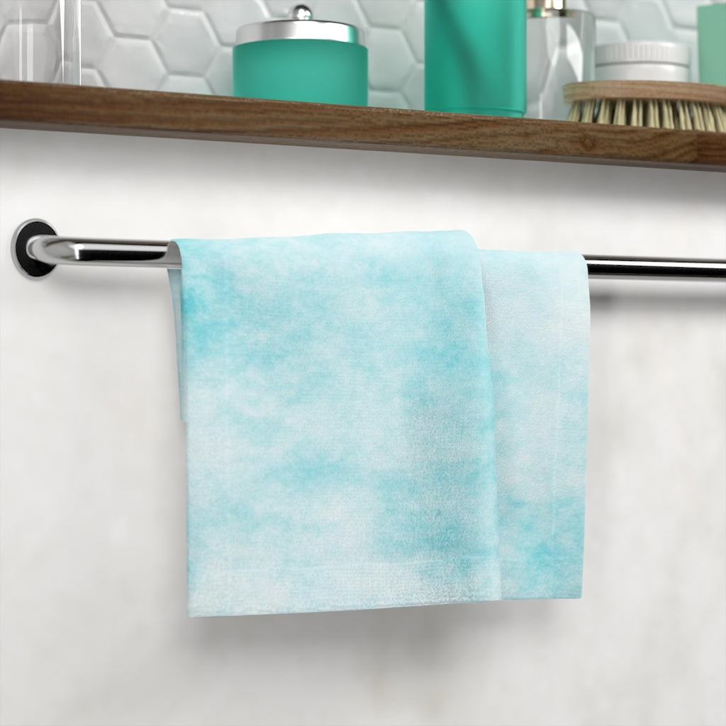 Blue Clouds Face Towel featuring a vibrant custom design on a soft polyester blend front and absorbent cotton back.