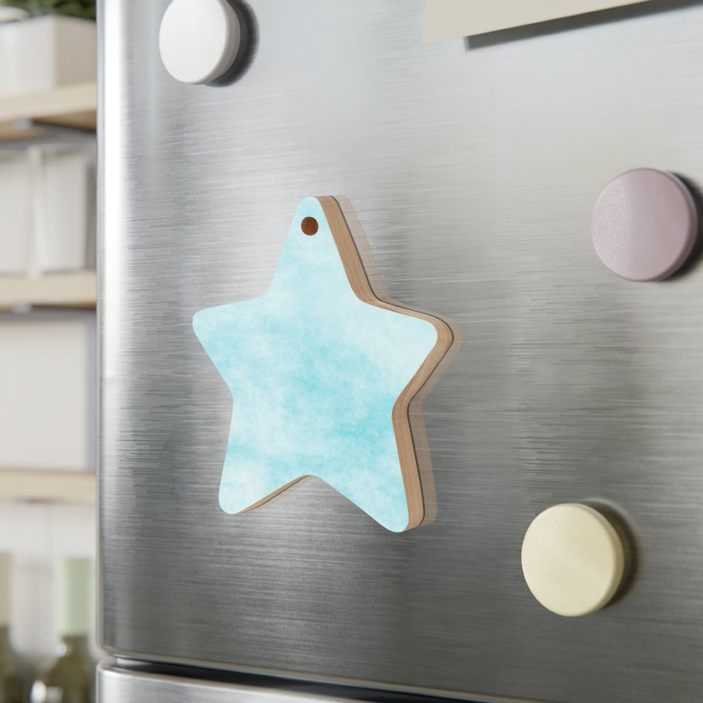 A collection of Blue Clouds Wooden Christmas Ornaments in various whimsical shapes, featuring a rustic wood finish and red ribbons for hanging.