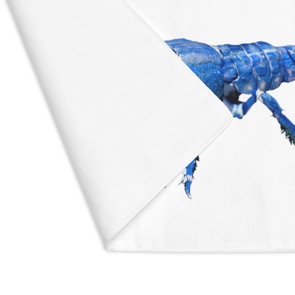 Blue Crawfish Placemat featuring a vibrant crawfish design on one side and a natural back, made from durable cotton.