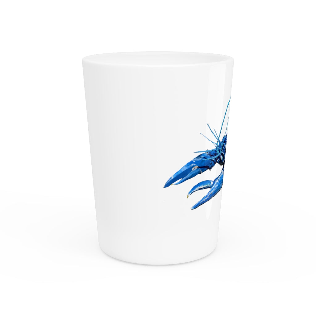 A personalized Blue Crawfish Shot Glass with a ceramic finish, available in white or black interior, perfect for gatherings and gifts.