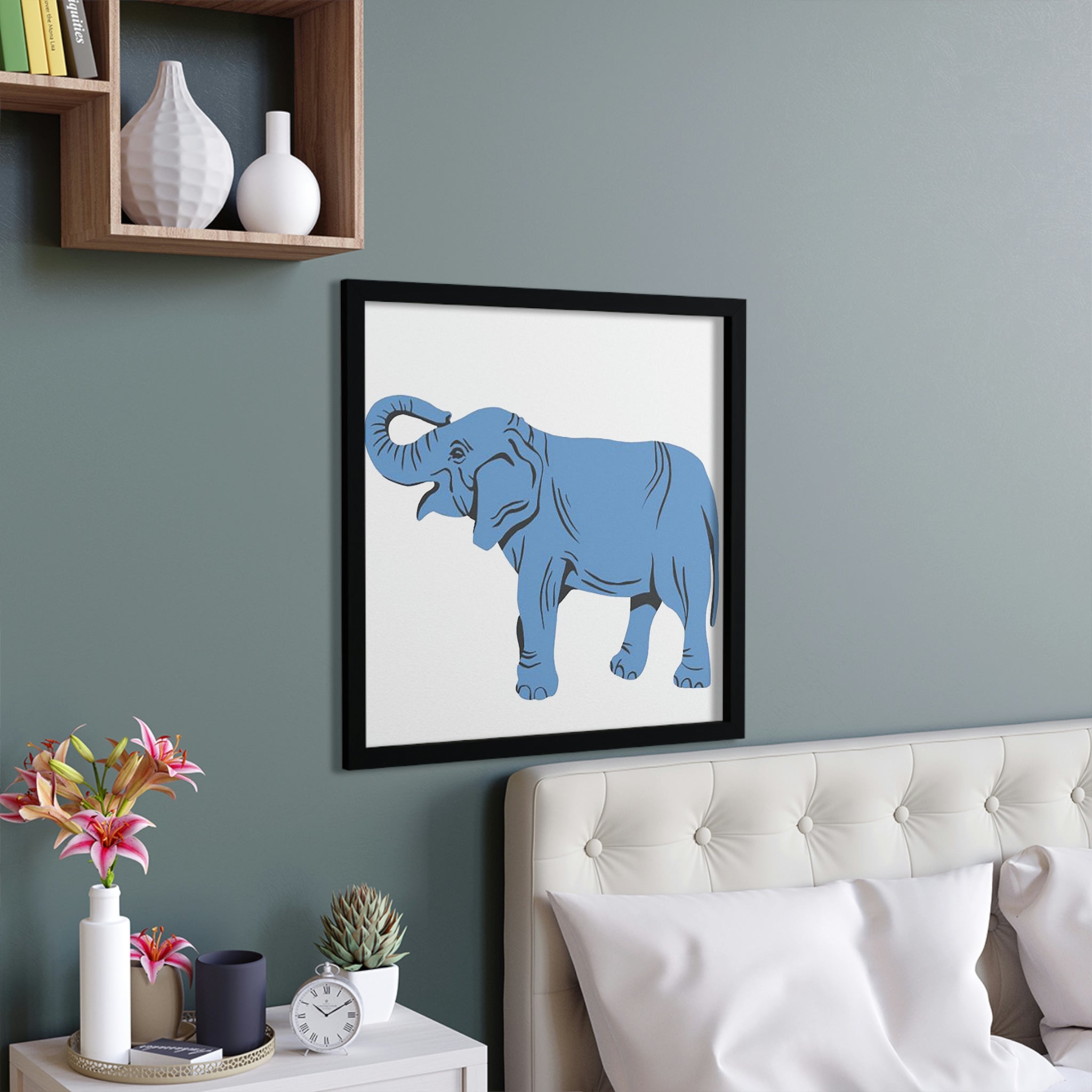 A beautifully framed poster featuring a blue elephant design, set in a hand-crafted wooden frame, ready for hanging.