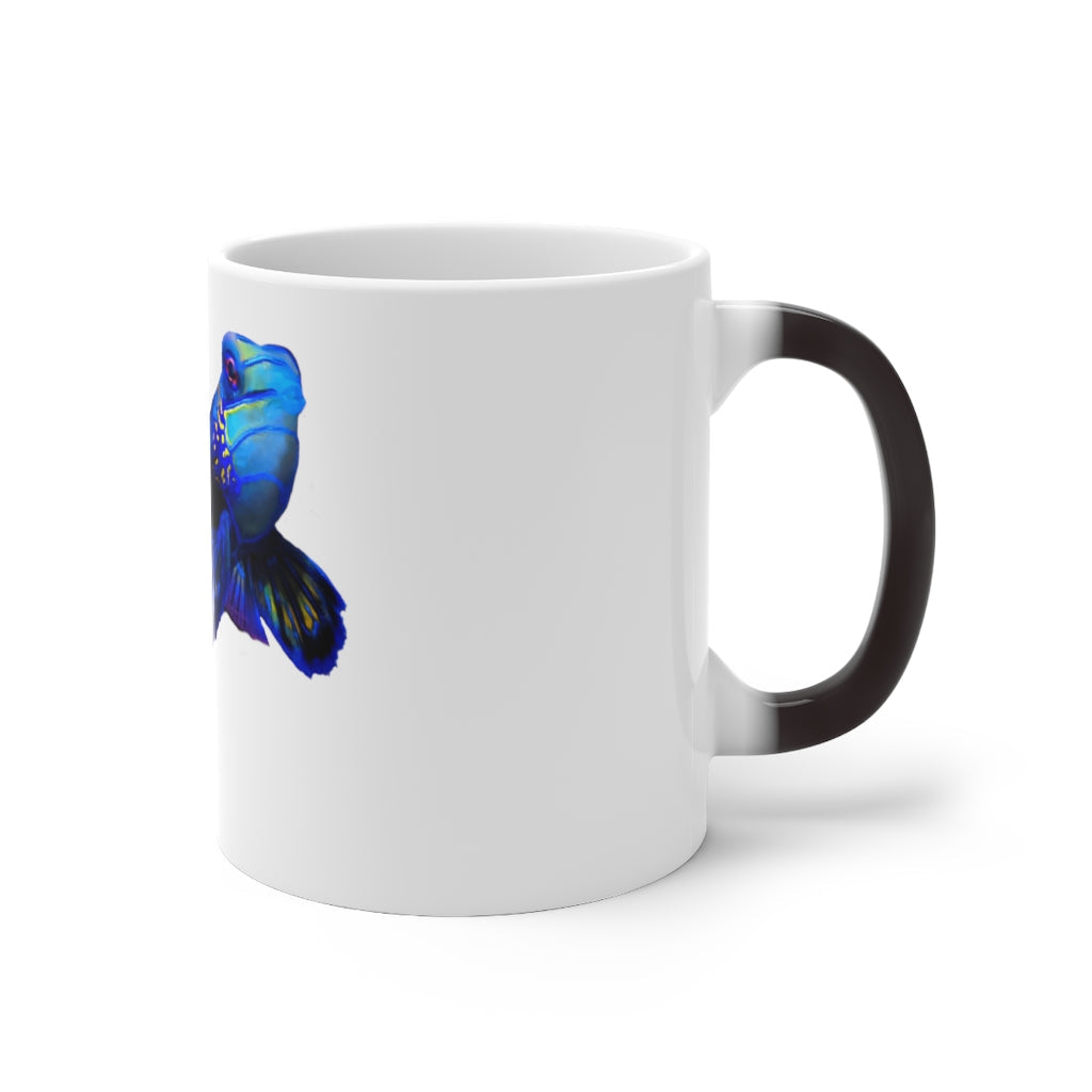 A blue fish color changing mug showcasing vibrant colors when filled with hot liquid, featuring a rounded design and C-handle.