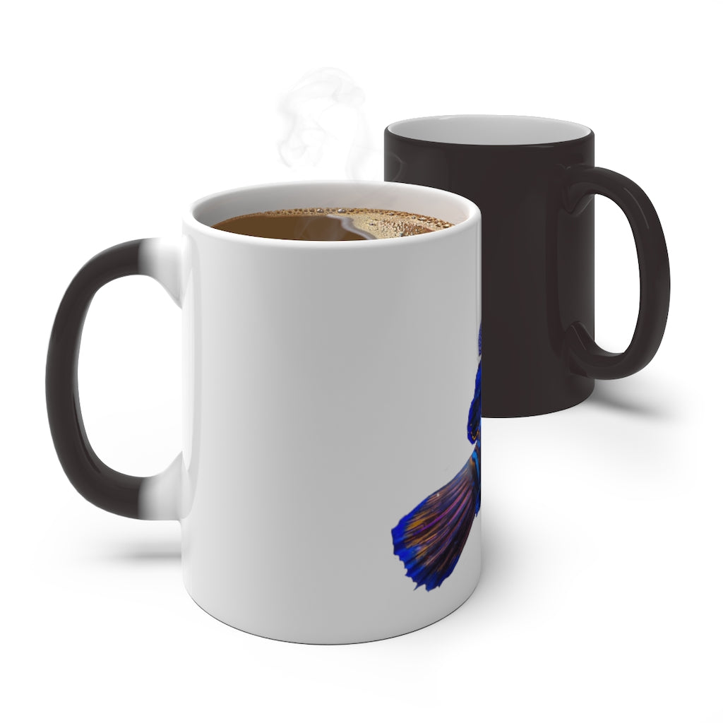 A blue fish color changing mug showcasing vibrant colors when filled with hot liquid, featuring a rounded design and C-handle.