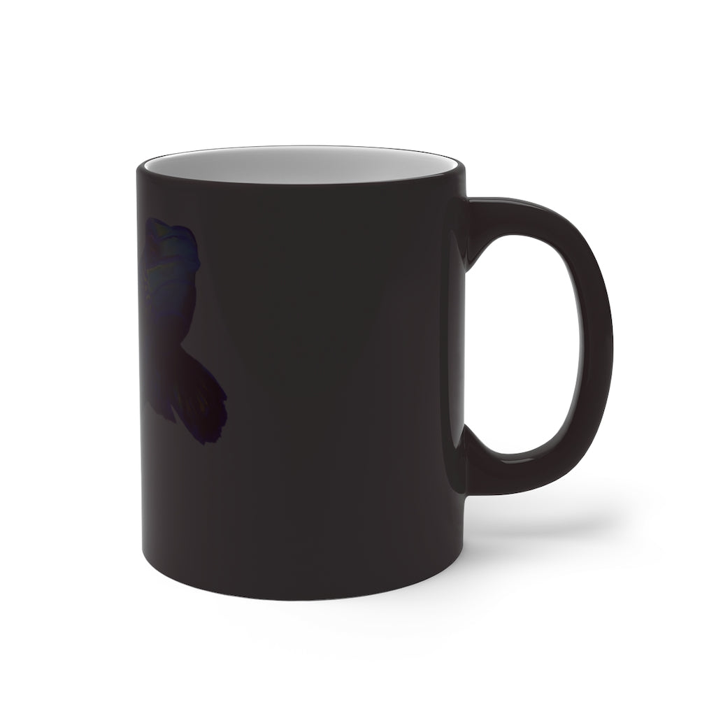 A blue fish color changing mug showcasing vibrant colors when filled with hot liquid, featuring a rounded design and C-handle.