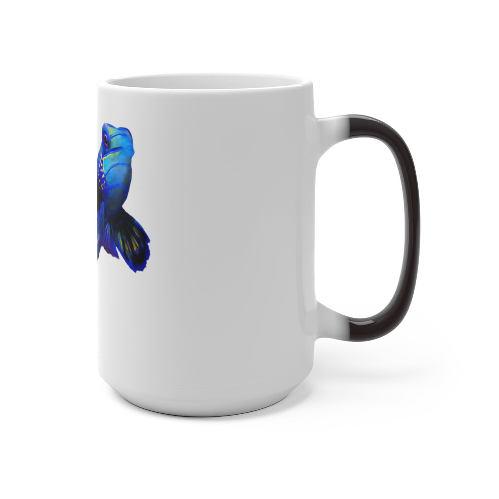 A blue fish color changing mug showcasing vibrant colors when filled with hot liquid, featuring a rounded design and C-handle.