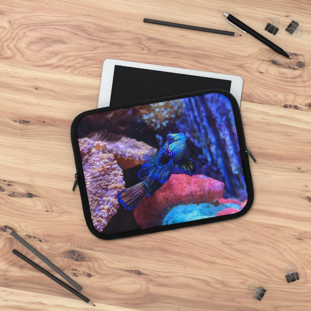 Blue Fish Laptop Sleeve featuring a vibrant fish design on the front and a solid black back, made from smooth neoprene material.