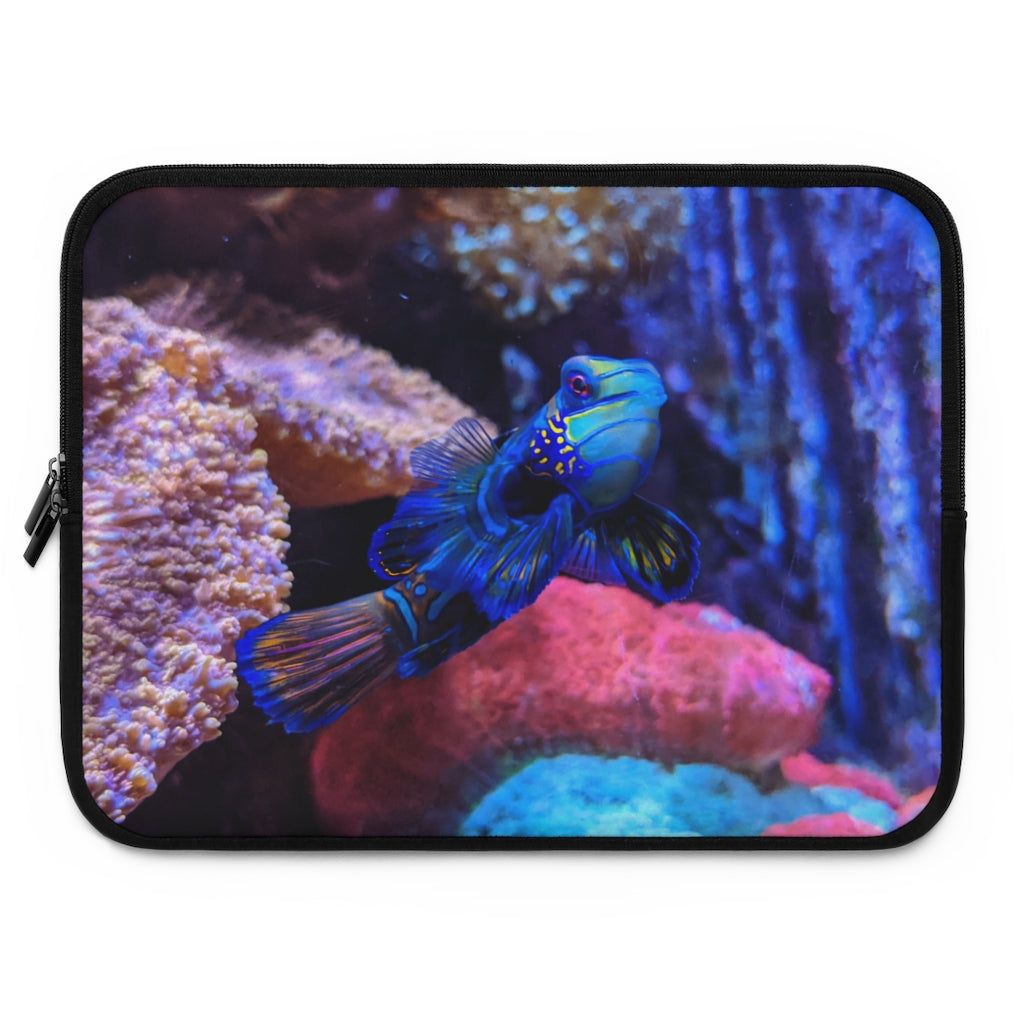 Blue Fish Laptop Sleeve featuring a vibrant fish design on the front and a solid black back, made from smooth neoprene material.