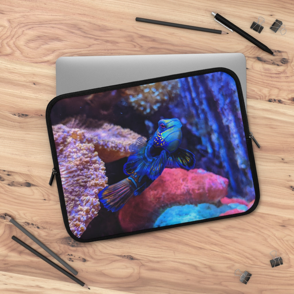 Blue Fish Laptop Sleeve featuring a vibrant fish design on the front and a solid black back, made from smooth neoprene material.