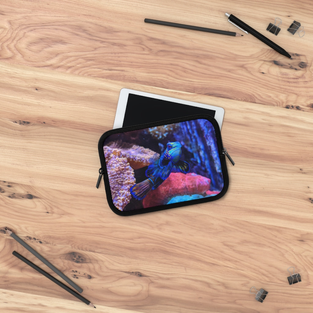 Blue Fish Laptop Sleeve featuring a vibrant fish design on the front and a solid black back, made from smooth neoprene material.