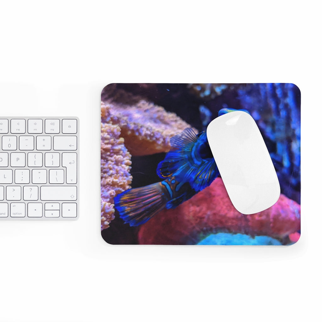 Blue Fish Mouse Pad featuring vibrant fish design on a smooth neoprene surface, ideal for enhancing desk aesthetics.