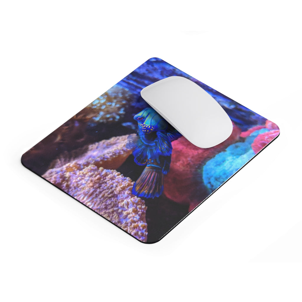 Blue Fish Mouse Pad featuring a vibrant design on a smooth neoprene surface, ideal for enhancing desk aesthetics.