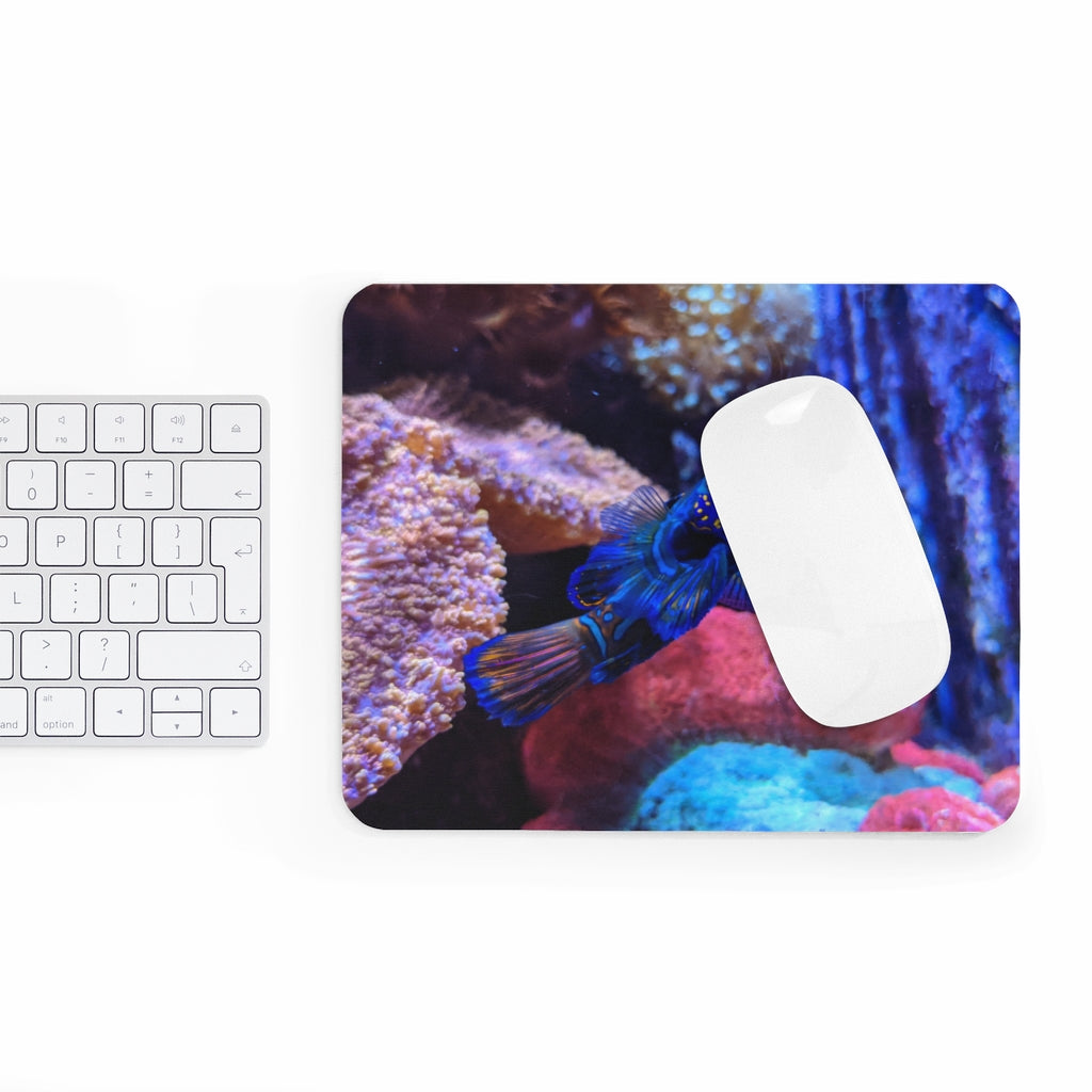 Blue Fish Mouse Pad featuring a vibrant design on a smooth neoprene surface, ideal for enhancing desk aesthetics.