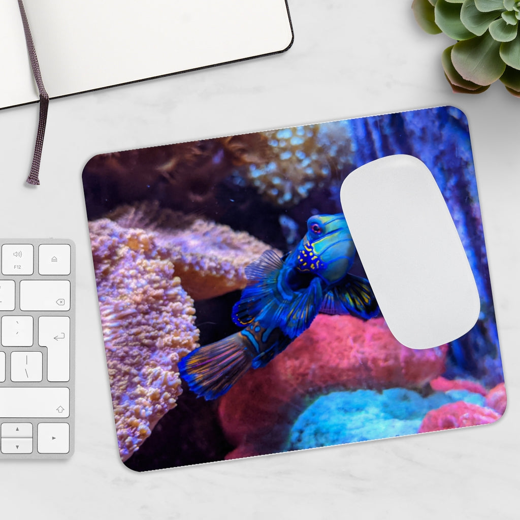 Blue Fish Mouse Pad featuring a vibrant design on a smooth neoprene surface, ideal for enhancing desk aesthetics.