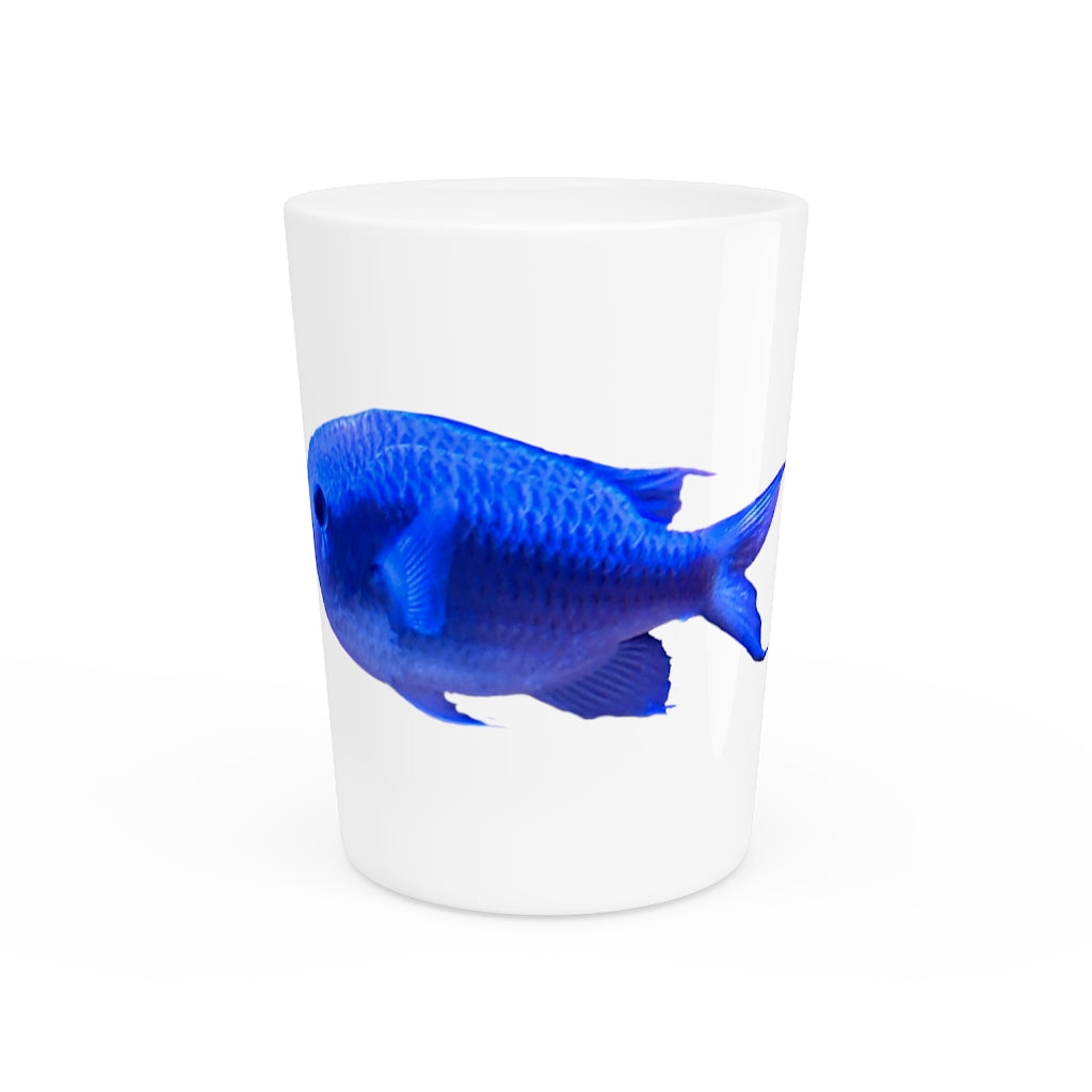 A stylish Blue Fish Shot Glass made of white ceramic with a customizable design, featuring a black interior.