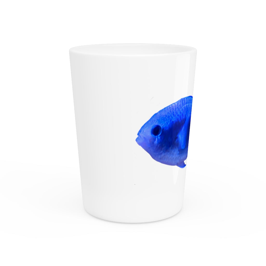 A stylish Blue Fish Shot Glass made of white ceramic with a customizable design, featuring a black interior.