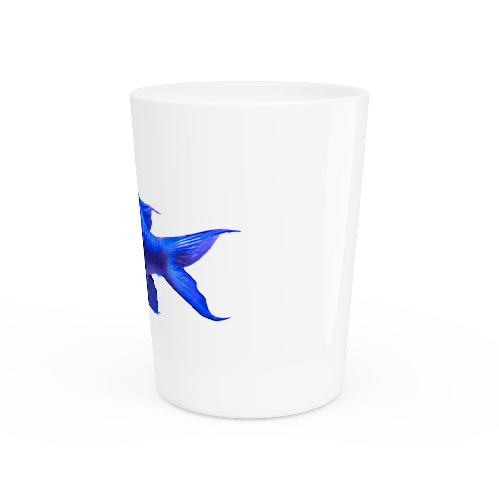 A stylish Blue Fish Shot Glass made of white ceramic with a customizable design, featuring a black interior.